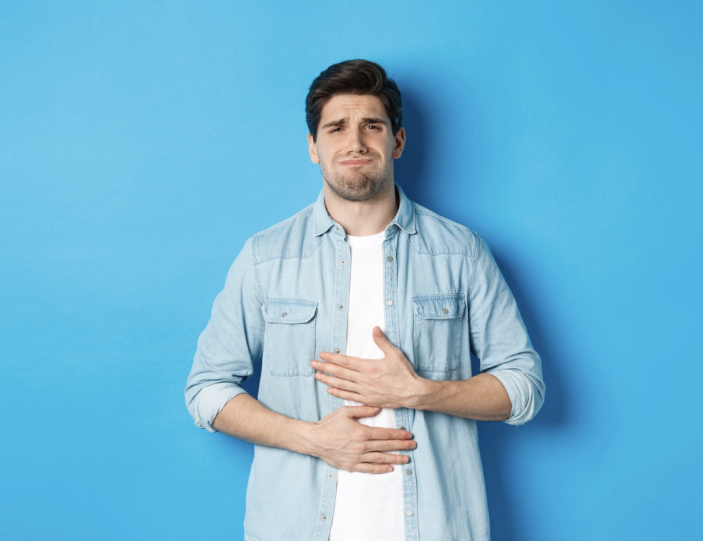 A male suffers from acid reflux causing discomfort. Acid reflux exaggerates erosive effect of bruxism. Thus, bruxism and acid reflux are complimentary in action.