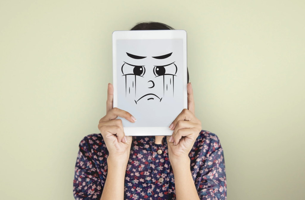 Image shows a person suffering from either stress, Anxiety or depression. All of which are psychological factors that lead to teeth grinding or bruxism.
