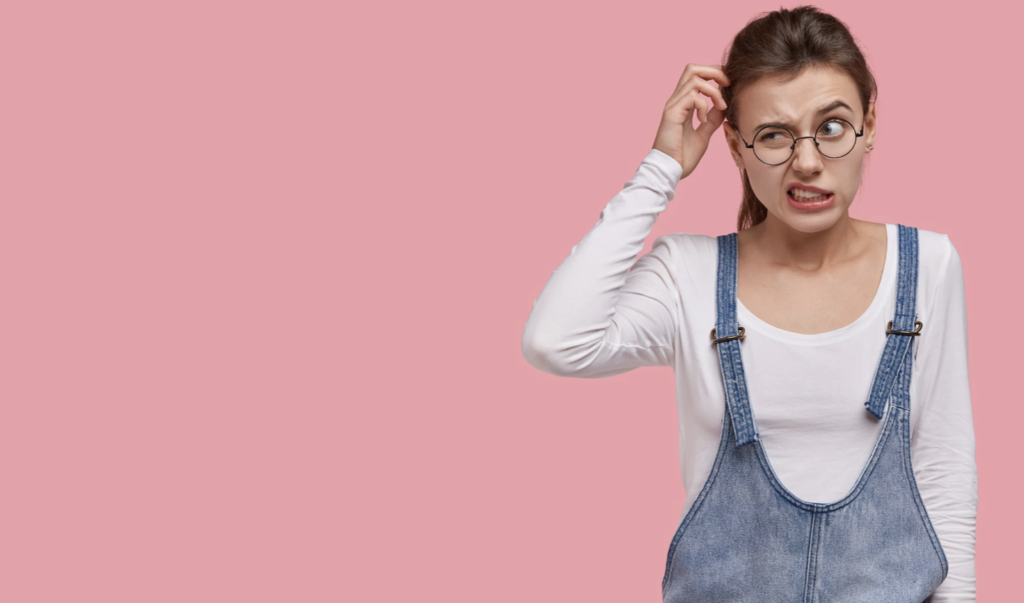 A girl is experiencing the side effects of bruxism on her teeth, gums, oral muscles and TMJ.